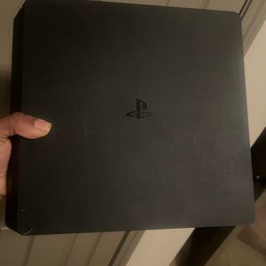A Ps4 Slim, and A Controller